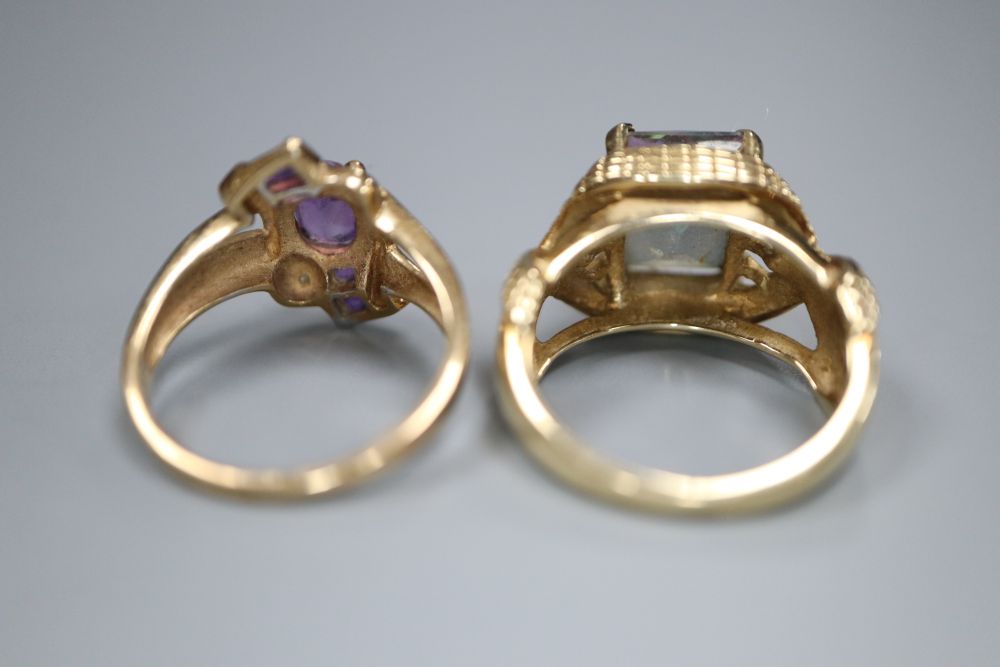 A 9ct gold and tourmaline? dress ring with fancy mount and a 9ct gold, amethyst and diamond crossover ring, gross 10.7g